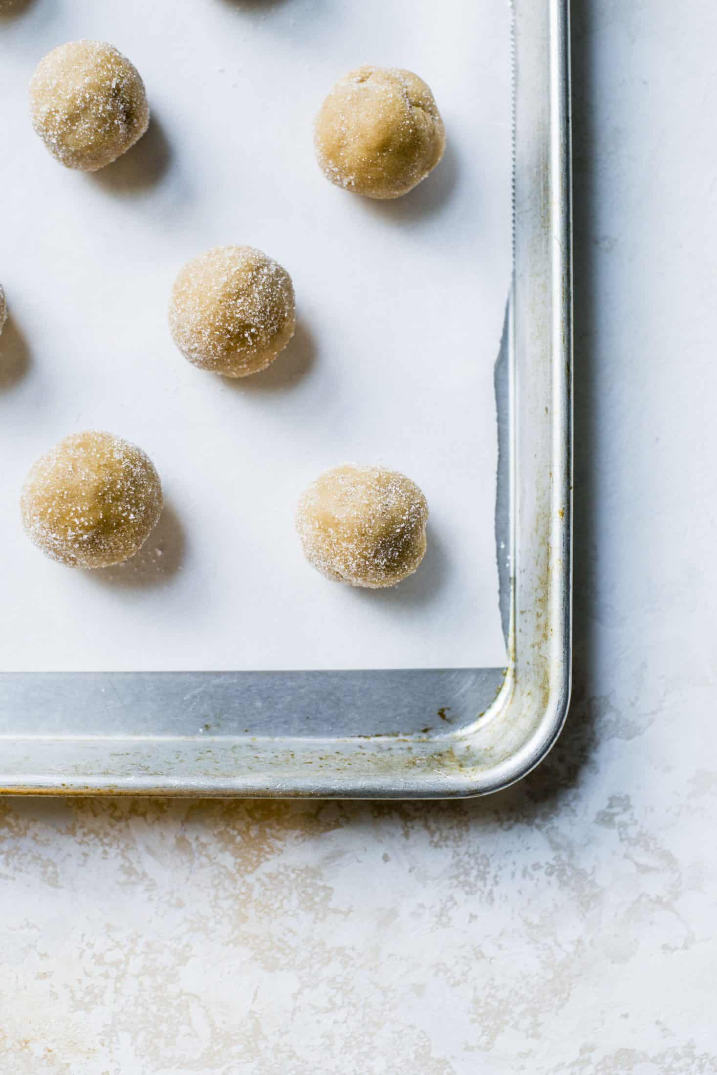 These are perfect peanut butter blossoms! My favorite cookie at christmastime has always been classic peanut butter blossoms and my grandma had the recipe nailed. These are super easy, delicious and will make a lot of cookies! I howsweeteats.com #peanutbutter #blossoms