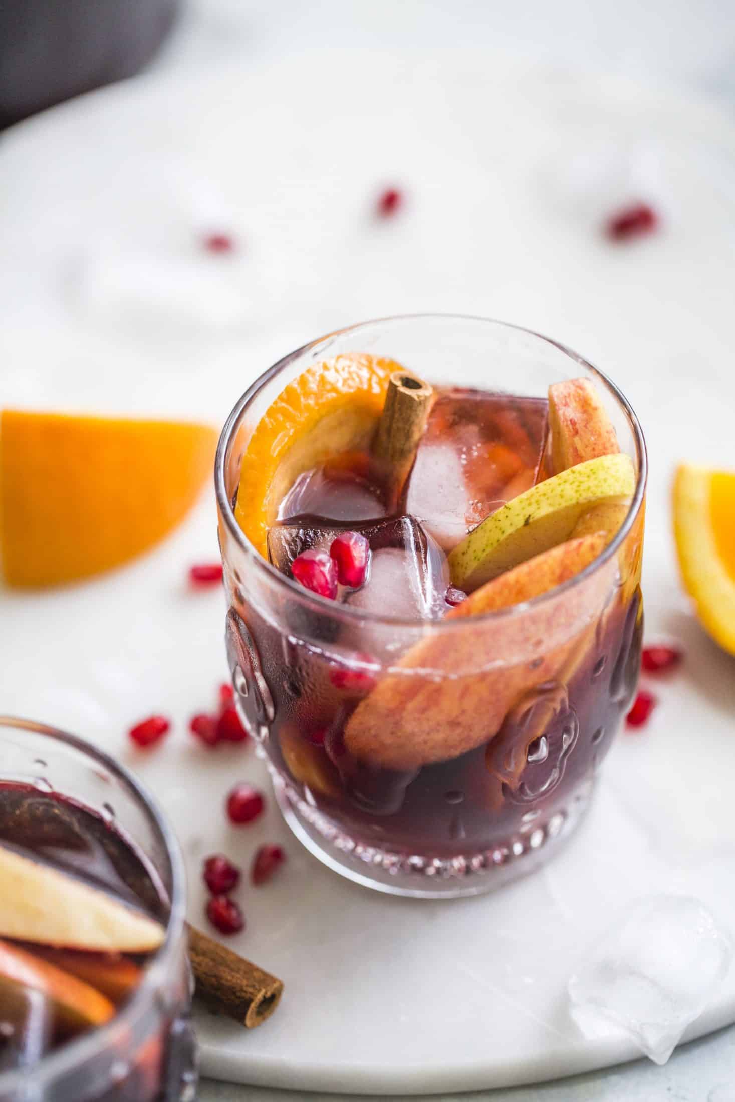 Pomegranate sangria is the best winter sangria ever! It comes in the form of delicious pomegranate vanilla sangria with lots of red wine and brandy. It's perfect for the cooler months and it will warm you right up. I howsweeteats.com #pomegranate #sangria