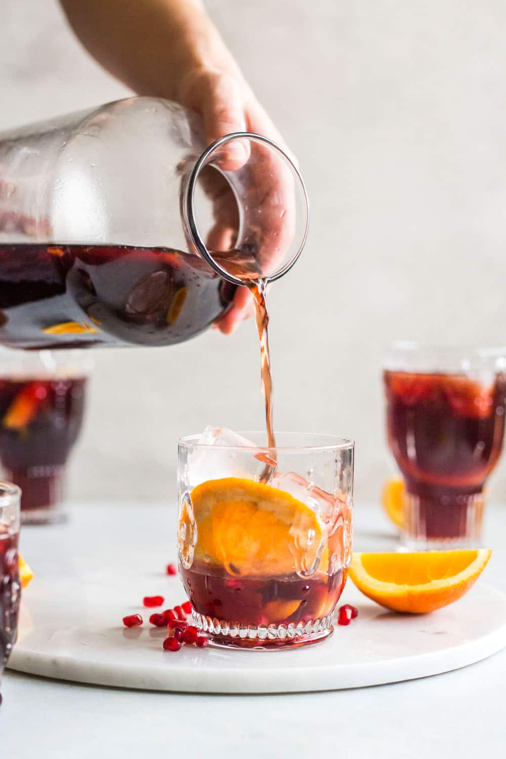 Pomegranate sangria is the best winter sangria ever! It comes in the form of delicious pomegranate vanilla sangria with lots of red wine and brandy. It's perfect for the cooler months and it will warm you right up. I howsweeteats.com #pomegranate #sangria