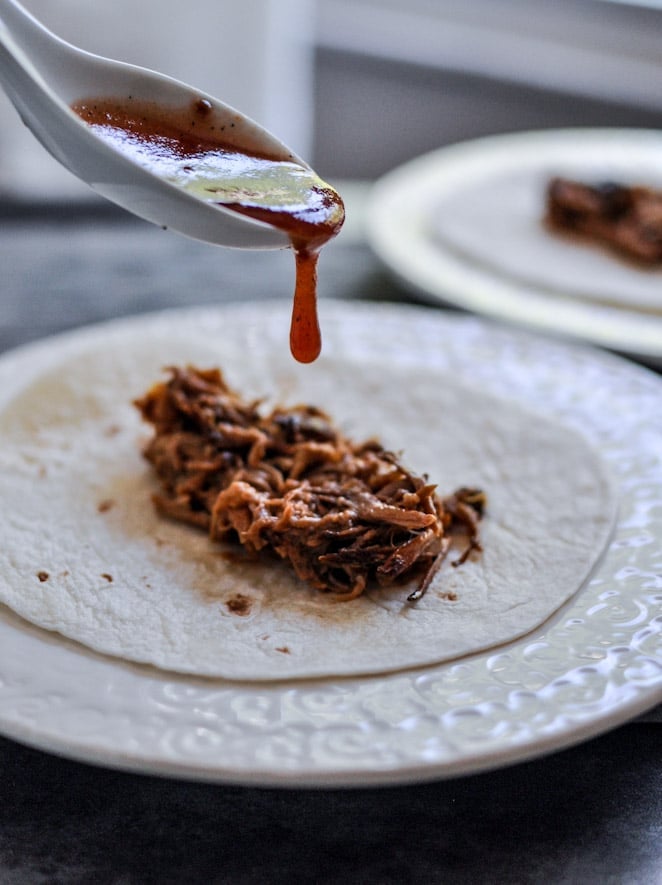 Crockpot BBQ Beer Pulled Pork Tacos with Crispy Onion Straws and Mango Salsa I howsweeteats.com Crockpot BBQ Beer Pulled Pork Tacos with Crispy Onion Straws and Mango Salsa I howsweeteats.com