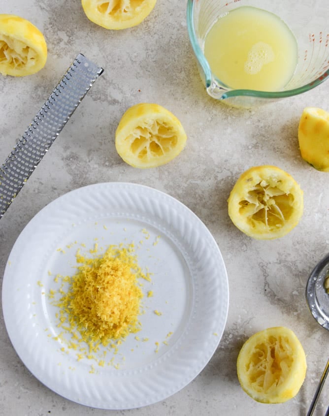 Easy Lemon Cake with Marshmallow Frosting + Toasted Coconut I howsweeteats.com Easy Lemon Cake with Marshmallow Frosting + Toasted Coconut I howsweeteats.com