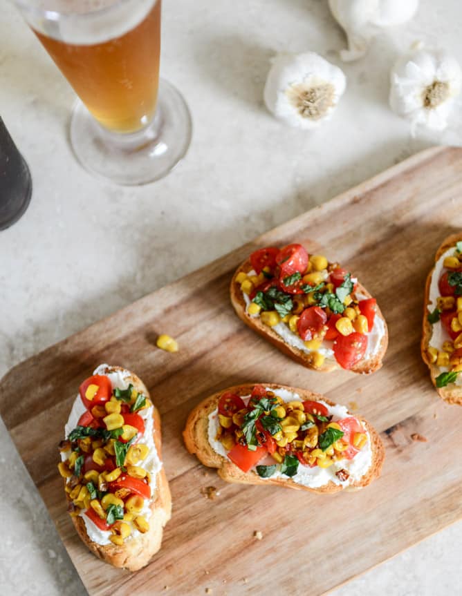 Summer Crostini with Whipped Roasted Garlic Goat Cheese I howsweeteats.com Summer Crostini with Whipped Roasted Garlic Goat Cheese I howsweeteats.com