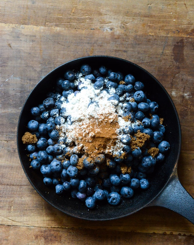 Skillet Blueberry Cobbler with a Cheddar Biscuit Crust I howsweeteats.com Skillet Blueberry Cobbler with a Cheddar Biscuit Crust I howsweeteats.com