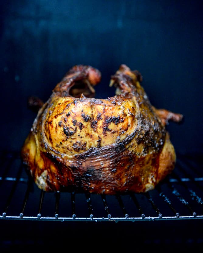 this applewood smoked turkey is prepped with a maple bourbon brine and served with a cider bourbon gravy! I howsweeteats.com this applewood smoked turkey is prepped with a maple bourbon brine and served with a cider bourbon gravy! I howsweeteats.com