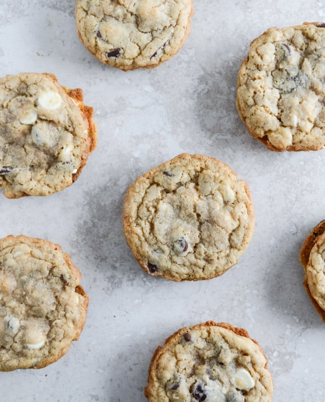Chewy Black + White Chip Oatmeal Sandwich Cookies with Marshmallow Buttercream Filling I howsweeteats.com Chewy Black + White Chip Oatmeal Sandwich Cookies with Marshmallow Buttercream Filling I howsweeteats.com
