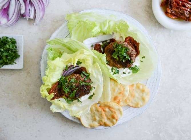 lamb slider lettuce wraps with whipped feta, artichokes and sun dried tomatoes I howsweeteats.com