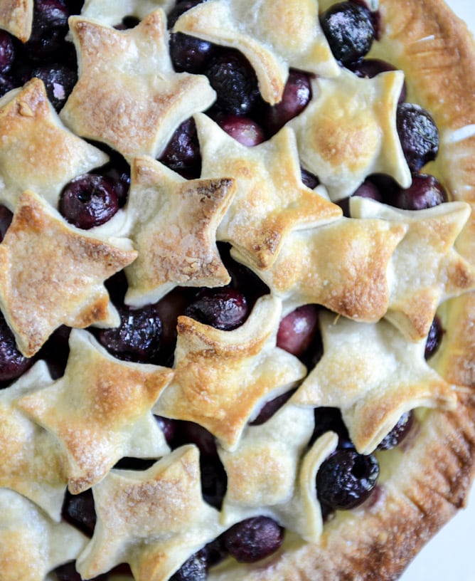 sweet cherry pie with amaretto whipped cream I howsweeteats.com