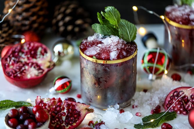 cranberry pomegranate juleps I howsweeteats.com #cocktails #christmas #cranberry #pomegranate #mintjulep