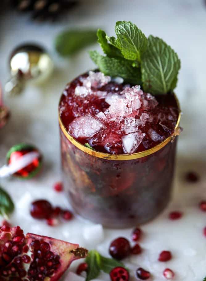 cranberry pomegranate juleps I howsweeteats.com #cocktails #christmas #cranberry #pomegranate #mintjulep