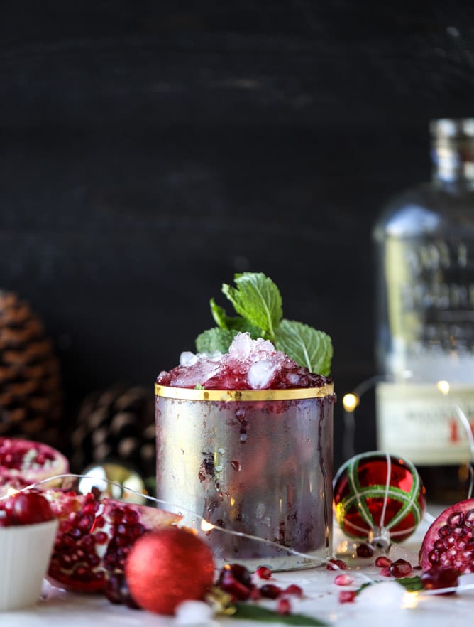 cranberry pomegranate juleps I howsweeteats.com #cocktails #christmas #cranberry #pomegranate #mintjulep