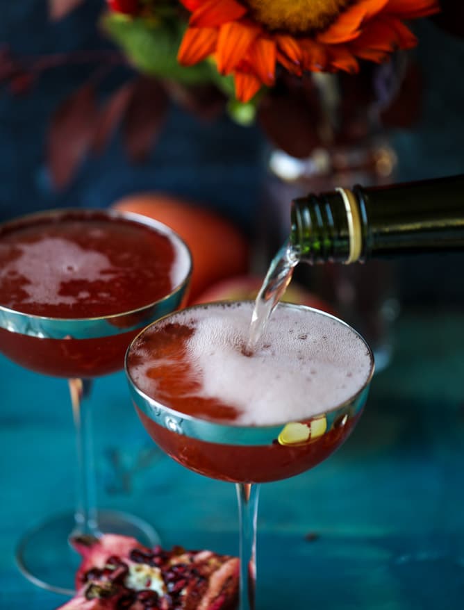 pomegranate cider mimosas with a salted caramel rim I howsweeteats.com #cocktails #thanksgiving #applecider #mimosas