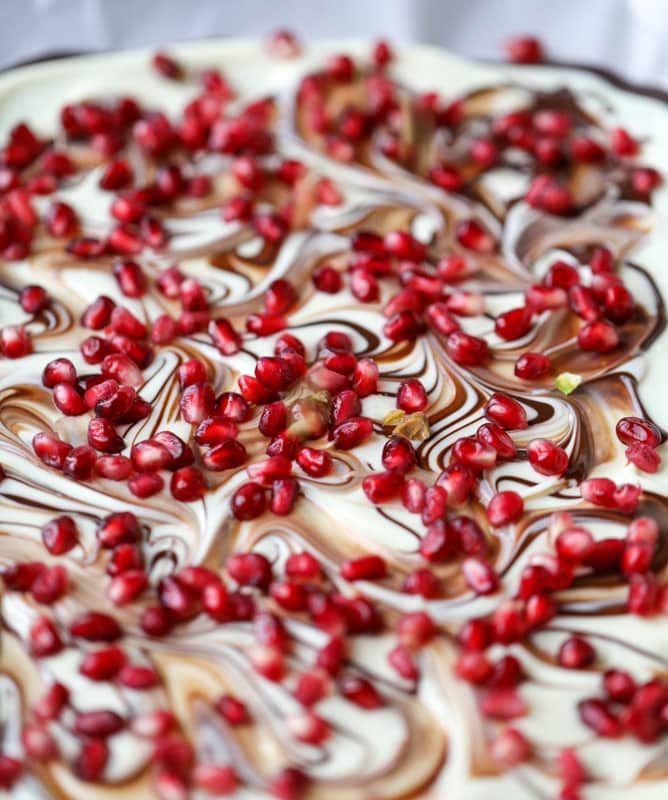 pomegranate pistachio swirled chocolate bark I howsweeteats.com #chocolate #bark #pomegranate #pistachio #christmas