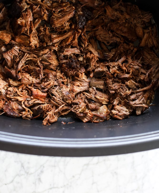 slow cooker shredded beef enchiladas I howsweeteats.com #beef #enchiladas #slowcooker