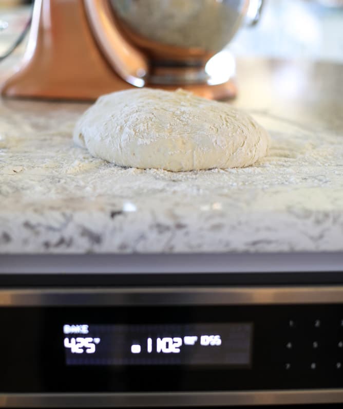 slow roasted cherry tomato pizza with garlic cream and arugula I howsweeteats.com #pizza #recipes