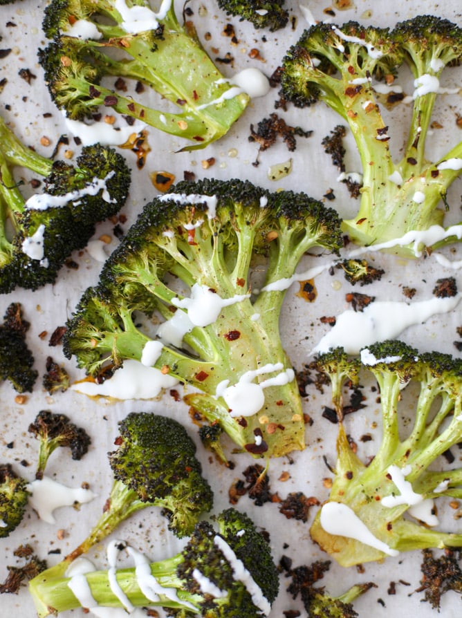 best roasted broccoli with goat cheese drizzle I howsweeteats.com #broccoli #roasted #goatcheese #spicy #lemon