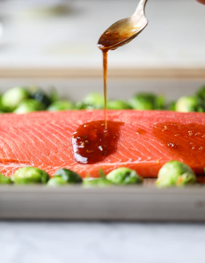 sheet pan honey garlic salmon and brussels I howsweeteats.com #sheetpan #salmon #honeygarlic #brusselssprouts