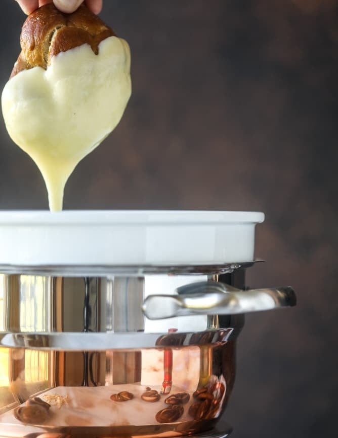 guinness soft pretzels with irish cheddar fondue I howsweeteats.com #softpretzels #fondue #irishcheddar #saintpatricksday #stpatricksday