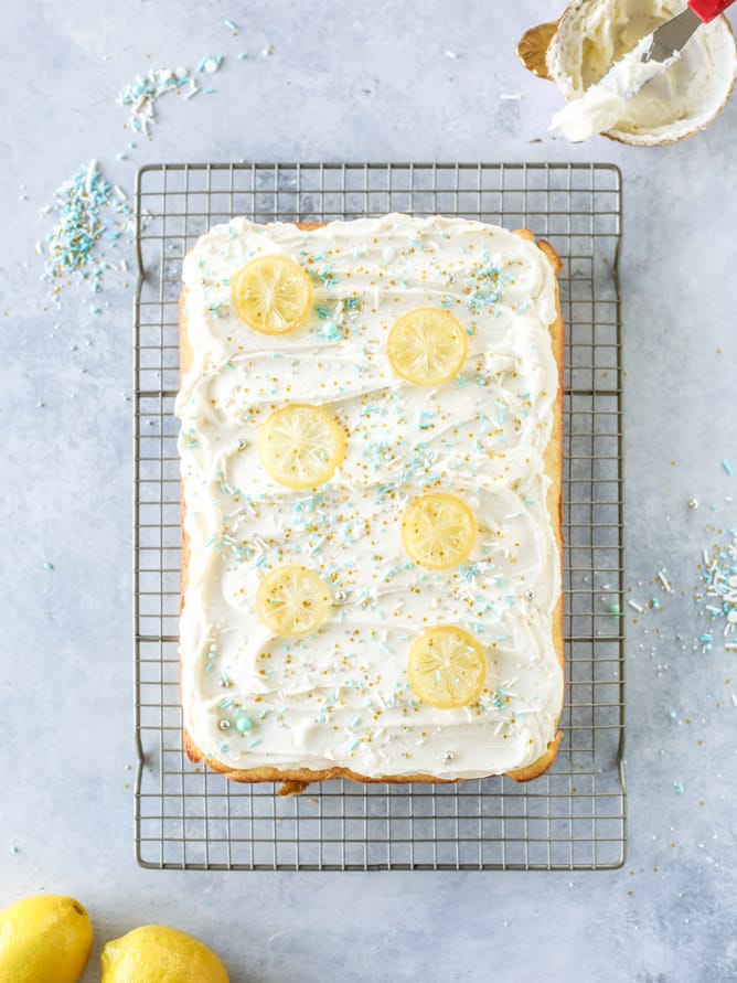 lemon sheet cake with cream cheese frosting I howsweeteats.com #lemon #cake #sheetcake #dessert #creamcheesefrosting