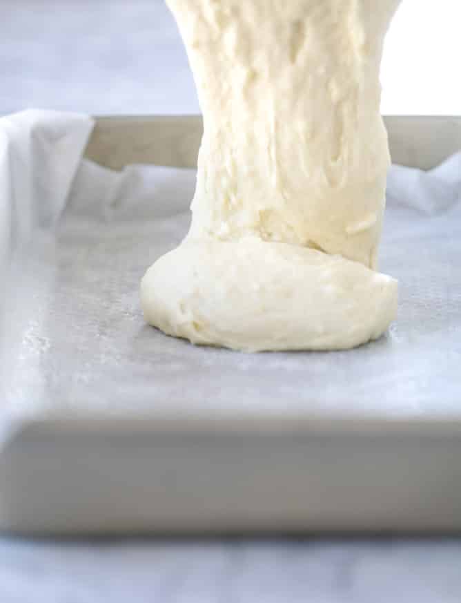 lemon sheet cake with cream cheese frosting I howsweeteats.com #lemon #cake #sheetcake #dessert #creamcheesefrosting