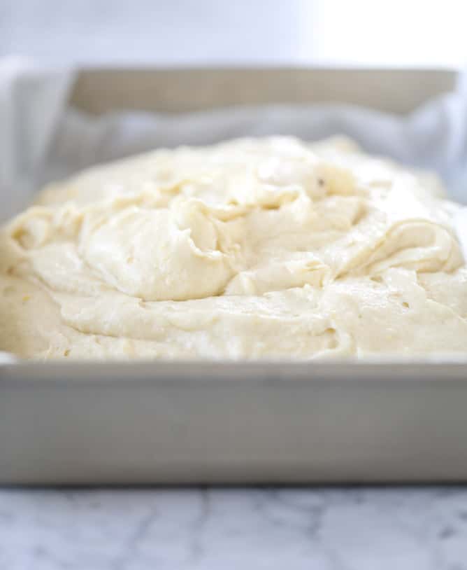 lemon sheet cake with cream cheese frosting I howsweeteats.com #lemon #cake #sheetcake #dessert #creamcheesefrosting