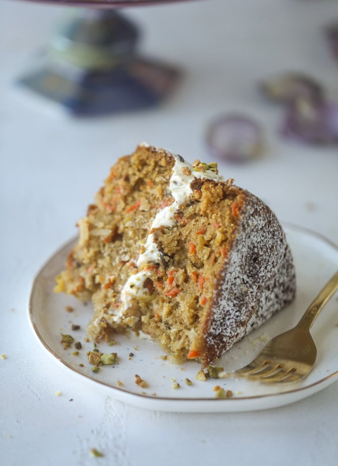 pistachio carrot cake with cream cheese frosting I howsweeteats.com #carrotcake #pistachio #cake #creamcheese #frosting