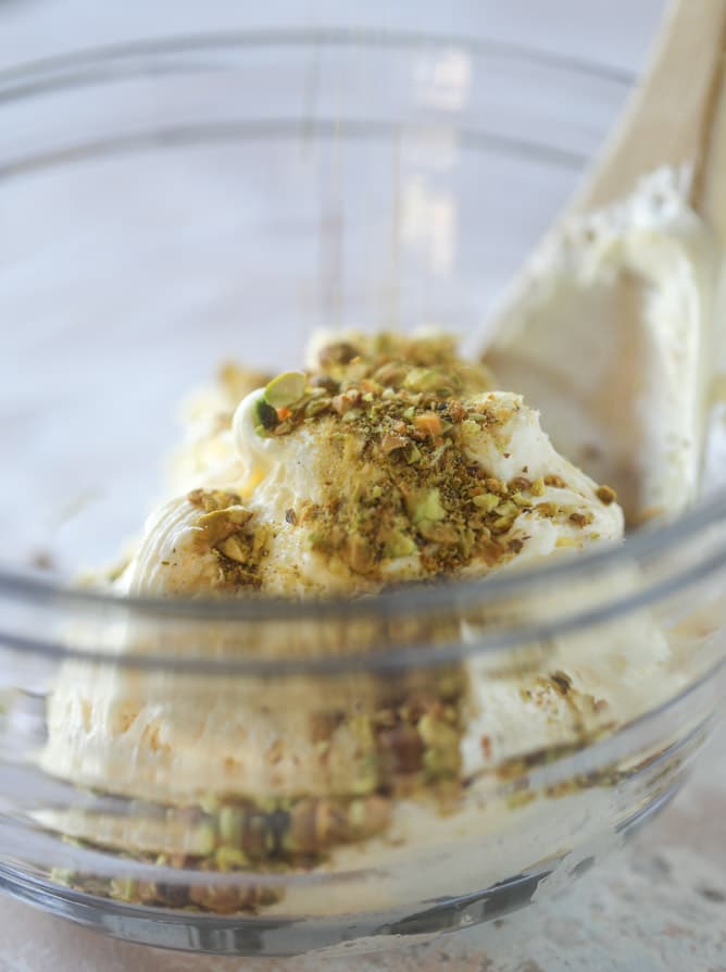 pistachio carrot cake with cream cheese frosting I howsweeteats.com #carrotcake #pistachio #cake #creamcheese #frosting