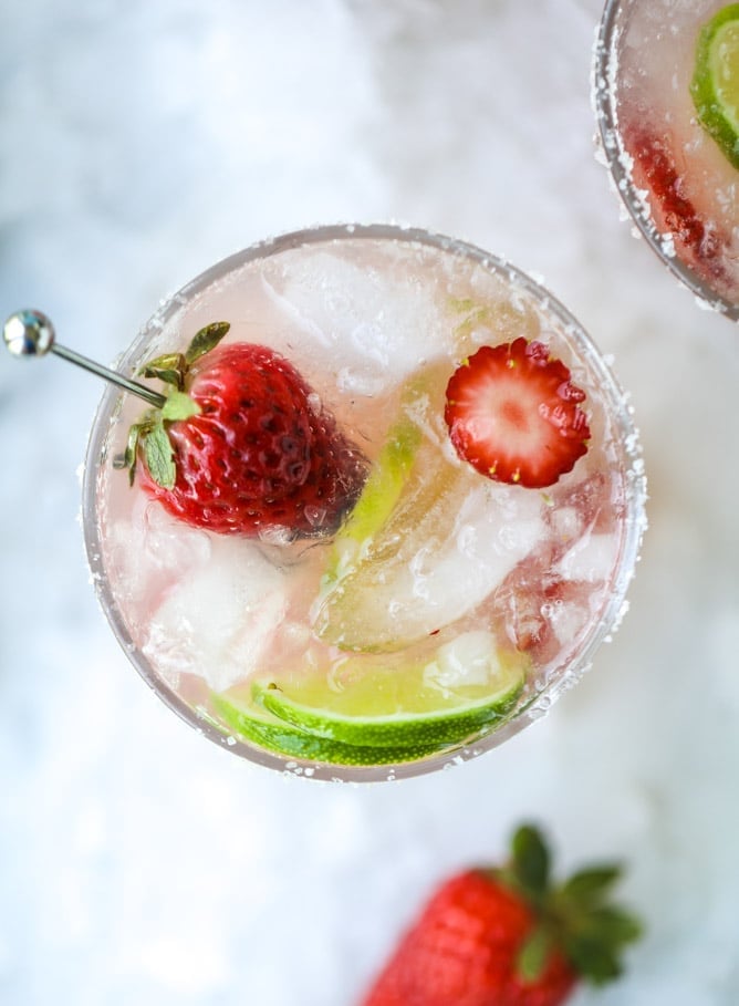 smoked strawberry mezcal margaritas I howsweeteats.com #margaritas #mezcal #strawberry #lime