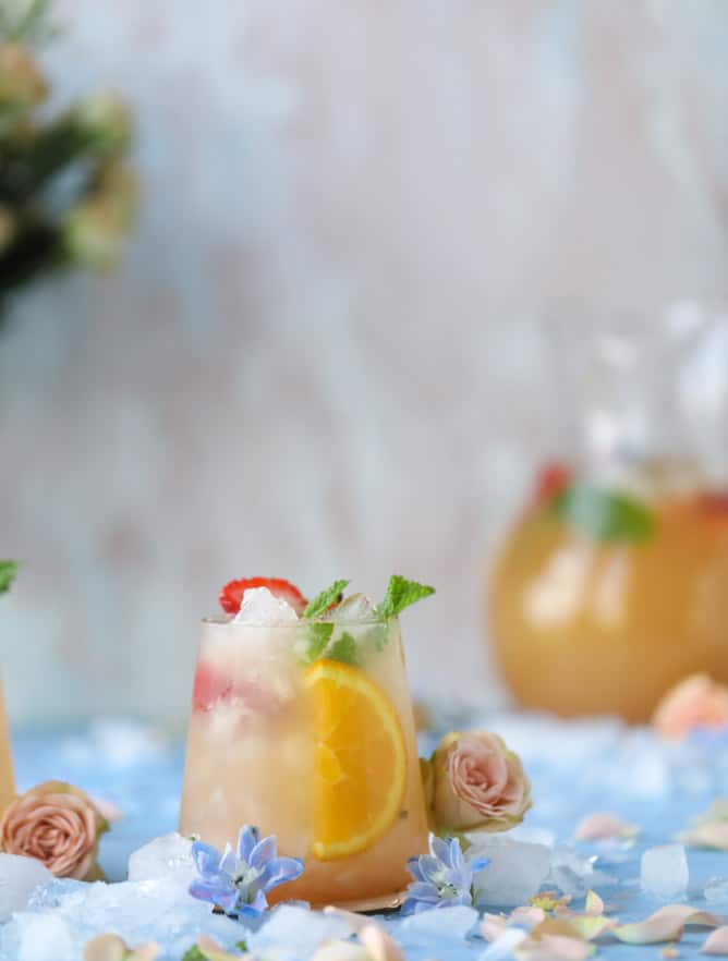 minted mimosa punch I howsweeteats.com #mimosa #punch #orangejuice #cocktails #champagne