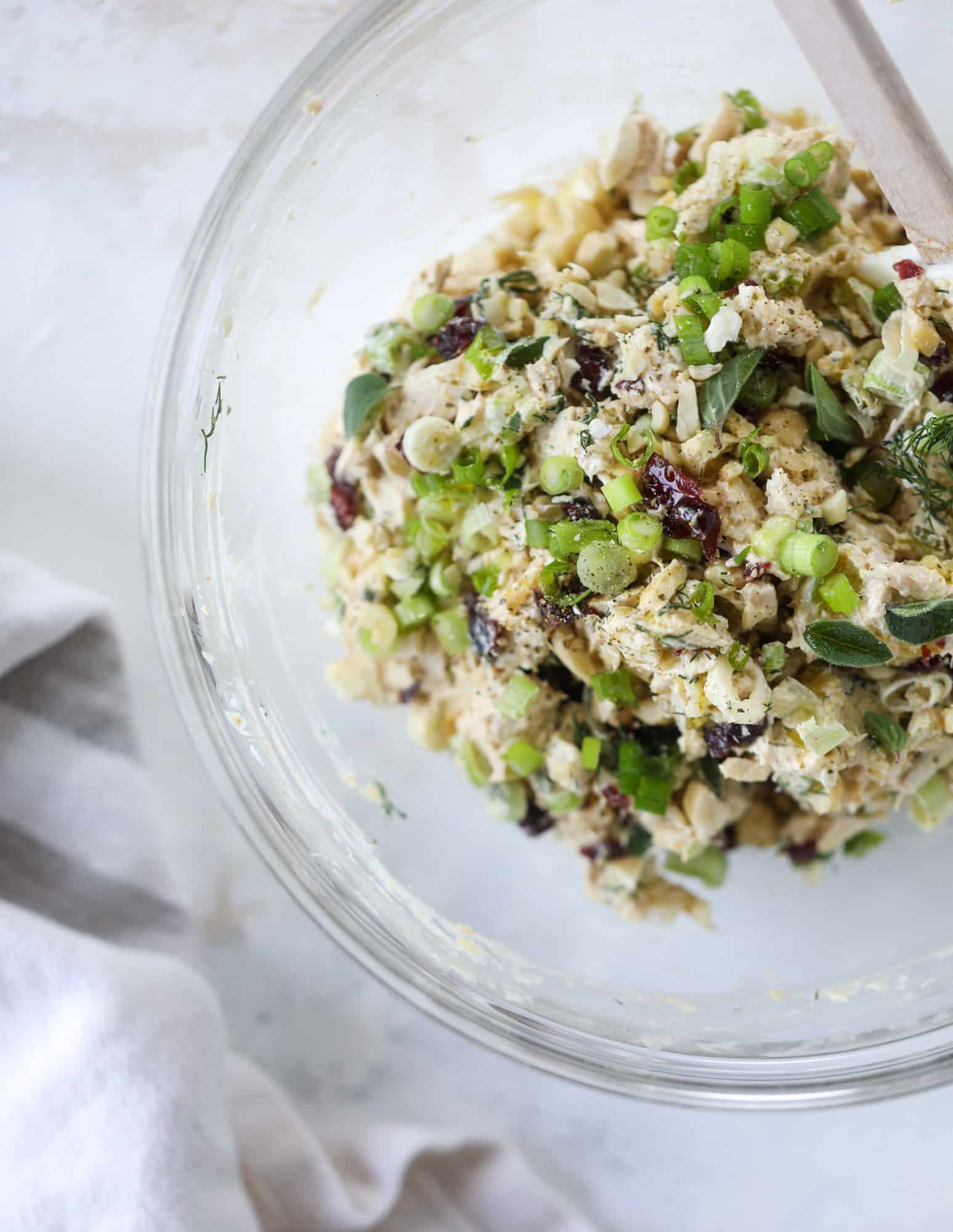 These smoky chicken salad stuffed avocados are lunchtime gold! They are super easy to throw together, satisfying and pretty darn great for you. Made with greek yogurt, some tangy mustard and dried cherries for sweetness, they are delish! I howsweeteats.com #chicken #salad #stuffed #avocados #greekyogurt