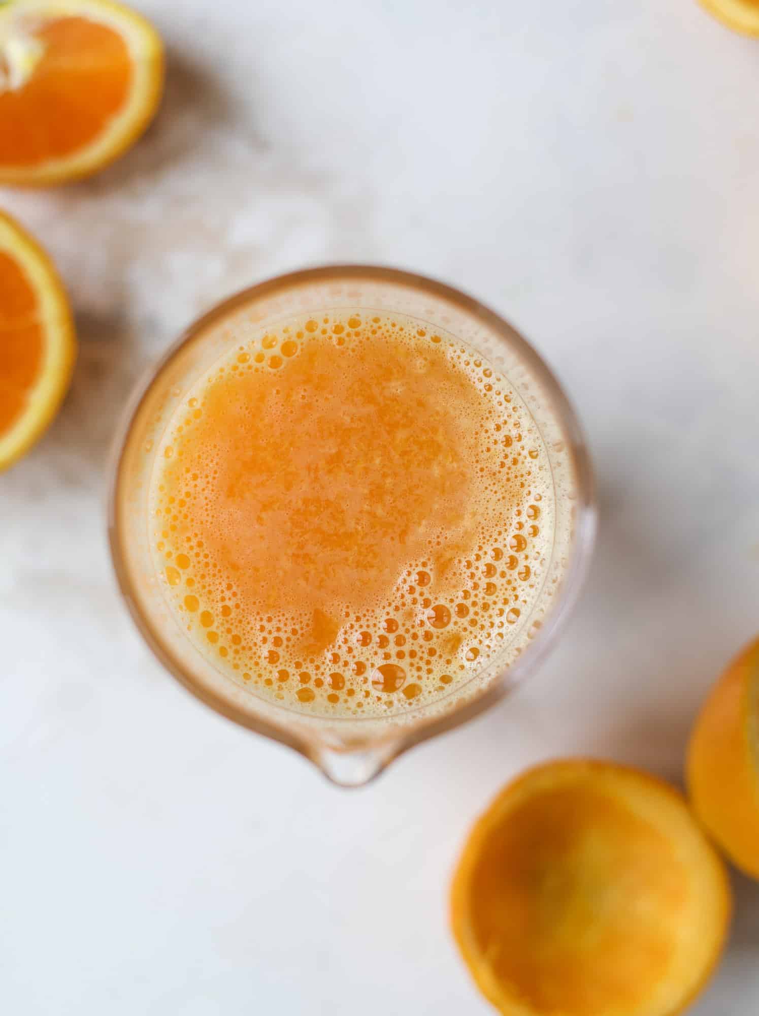 This orange crush is a copycat cocktail from the ones served in Ocean City, Maryland at the beach all summer long! It's one entire freshly squeezed orange with vodka and lemon lime soda and it tastes like heaven. Super refreshing and perfect for summer. I howsweeteats.com #orange #crush #cocktail #ocean #city #vodka