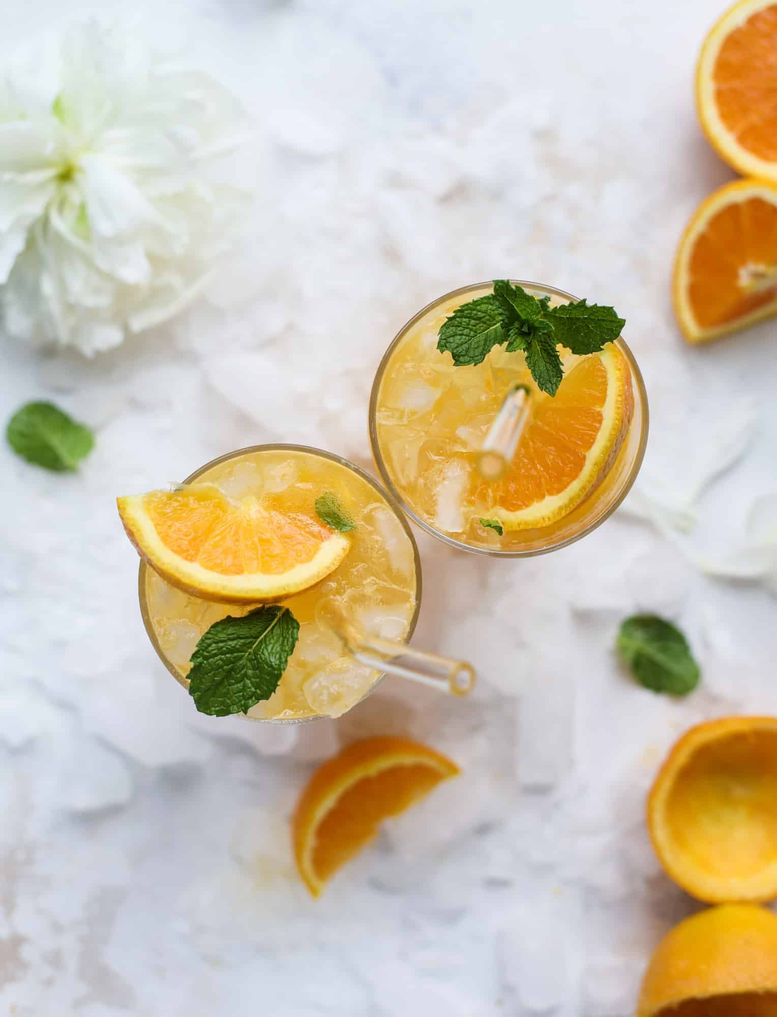 This orange crush is a copycat cocktail from the ones served in Ocean City, Maryland at the beach all summer long! It's one entire freshly squeezed orange with vodka and lemon lime soda and it tastes like heaven. Super refreshing and perfect for summer. I howsweeteats.com #orange #crush #cocktail #ocean #city #vodka