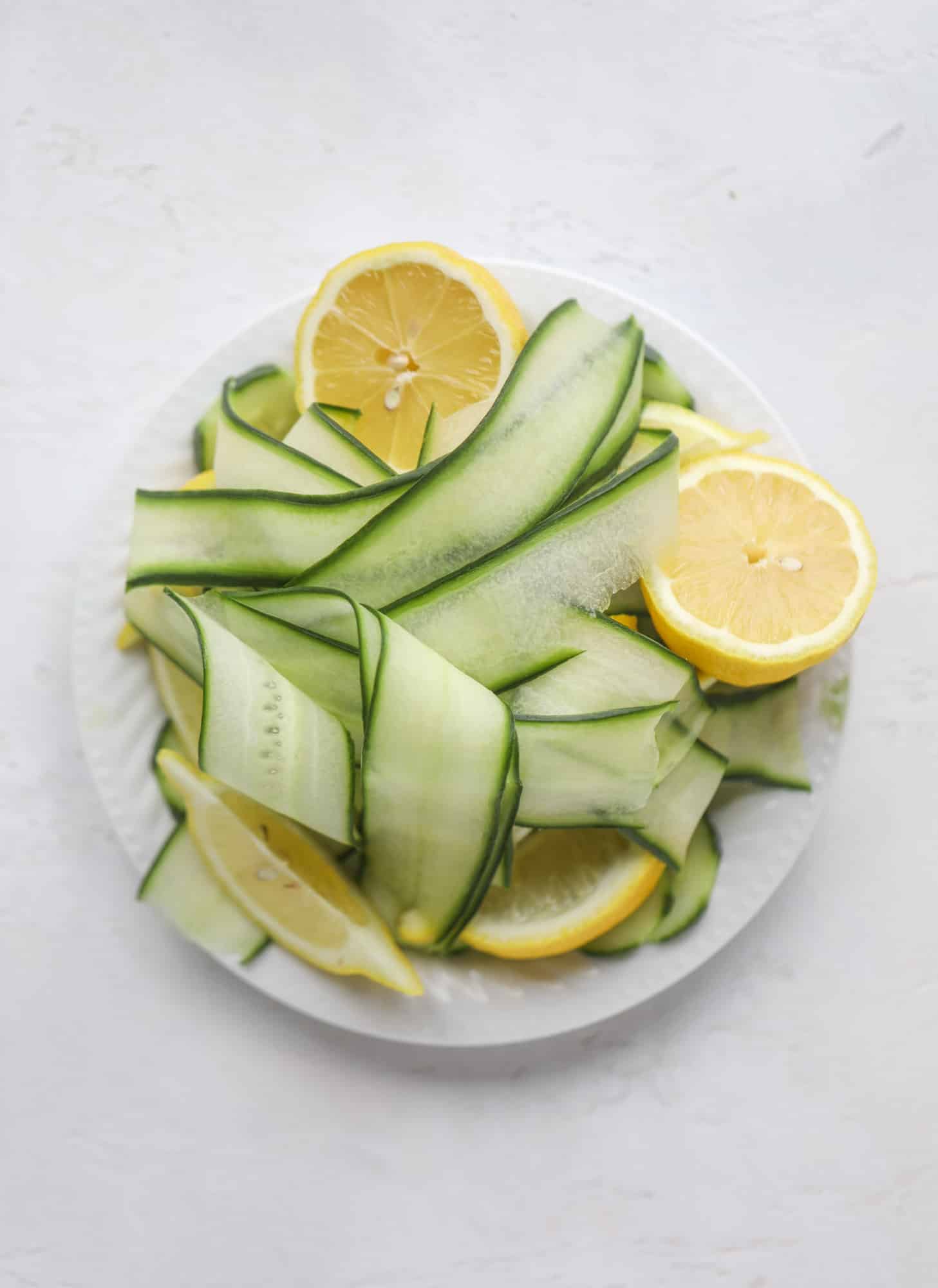 I love a delicious Pimm's Cup in the heart of summer! This was is topped with sparkling rosé wine and filled with strawberries, cucumbers and lemon wedges. It's super refreshing and perfect on hot hot days! I howsweeteats.com #pimms #cup #recipe #cocktails #rosé #sparkling #summer