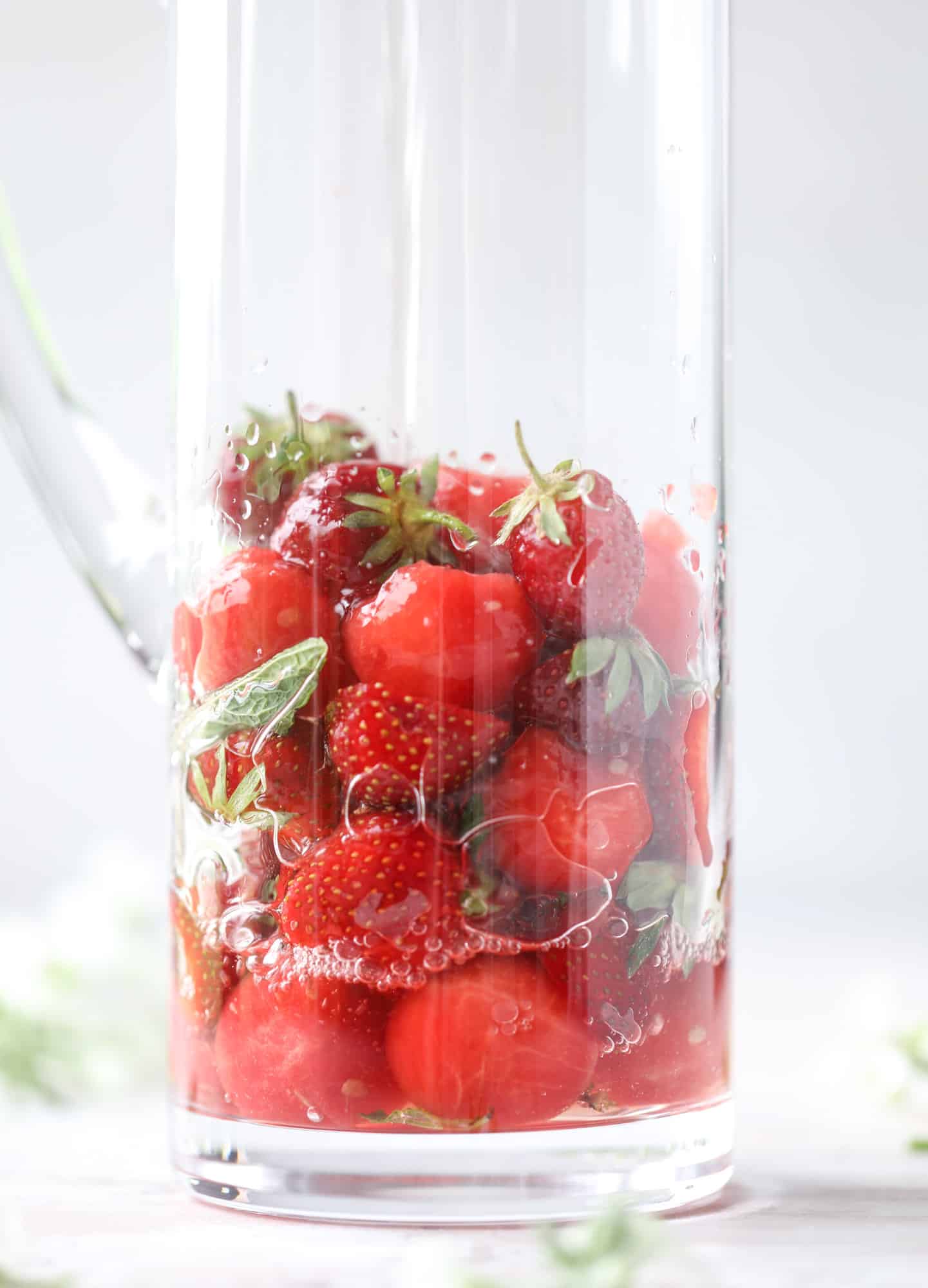 This spicy watermelon sangria is super refreshing, light, delicious and perfect for a hot summer day! Complete with an entire bottle of rosé, watermelon juice, melon balls, strawberries and brandy, this is the best summer cocktail in a pitcher! I howsweeteats.com #spicy #watermelon #sangria #cocktails #rosé