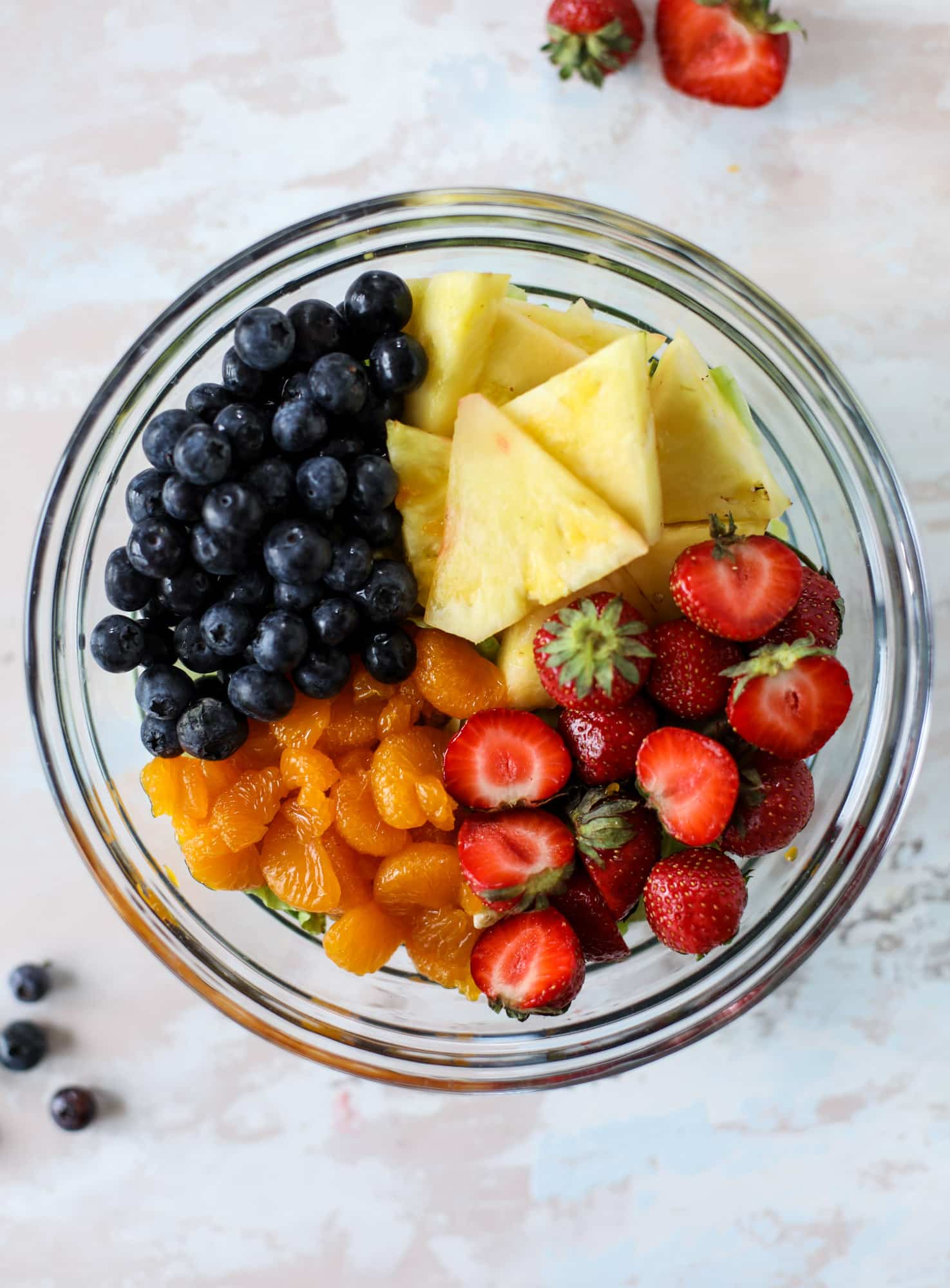 This copycat Panera strawberry poppyseed salad is absolutely delicious and refreshing and perfect for summer! Serve it with grilled chicken like the recipe here or swap for shrimp or fish. I howsweeteats.com #strawberry #poppyseed #salad #chicken #panera #copycat