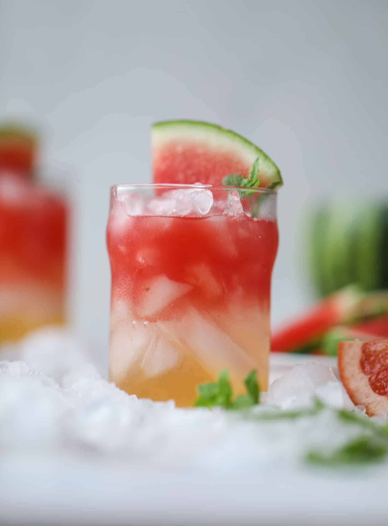 This watermelon grapefruit paloma cocktail is a summertime dream! Grapefruit syrup is super easy to make and when it's combined with fresh watermelon juice and tequila... oooh! Best happy hour ever. I howsweeteats.com #grapefruit #watermelon #paloma #cocktail #tequila