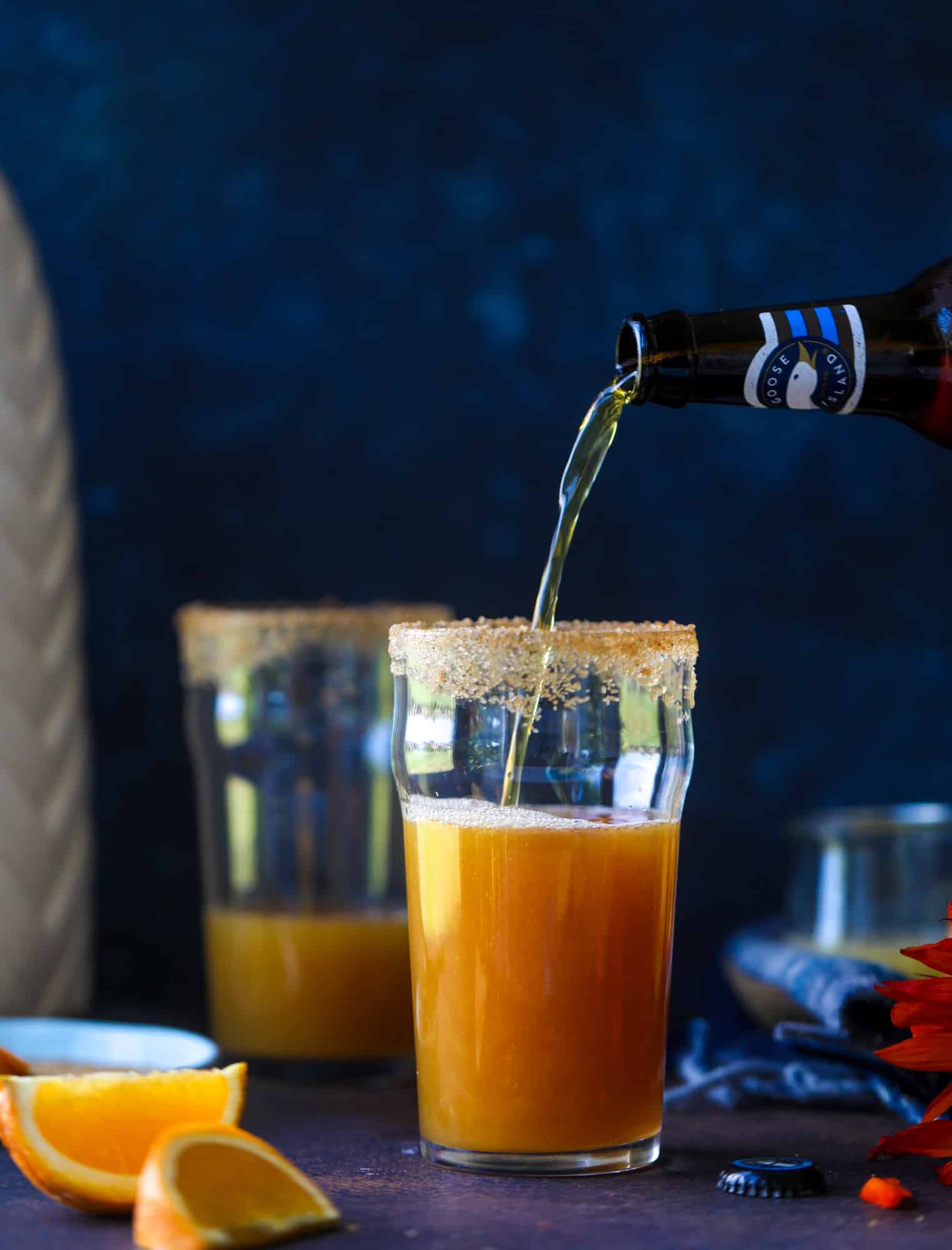 This apple cider shandy recipes is perfect for the fall season! Apple cider, sparkling cider and your favorite beer come together in an icy glass to create the best flavor ever. Finished with a cinnamon sugar rim, there's nothing better! I howsweeteats.com #apple #cider #shandy #cocktails #beer