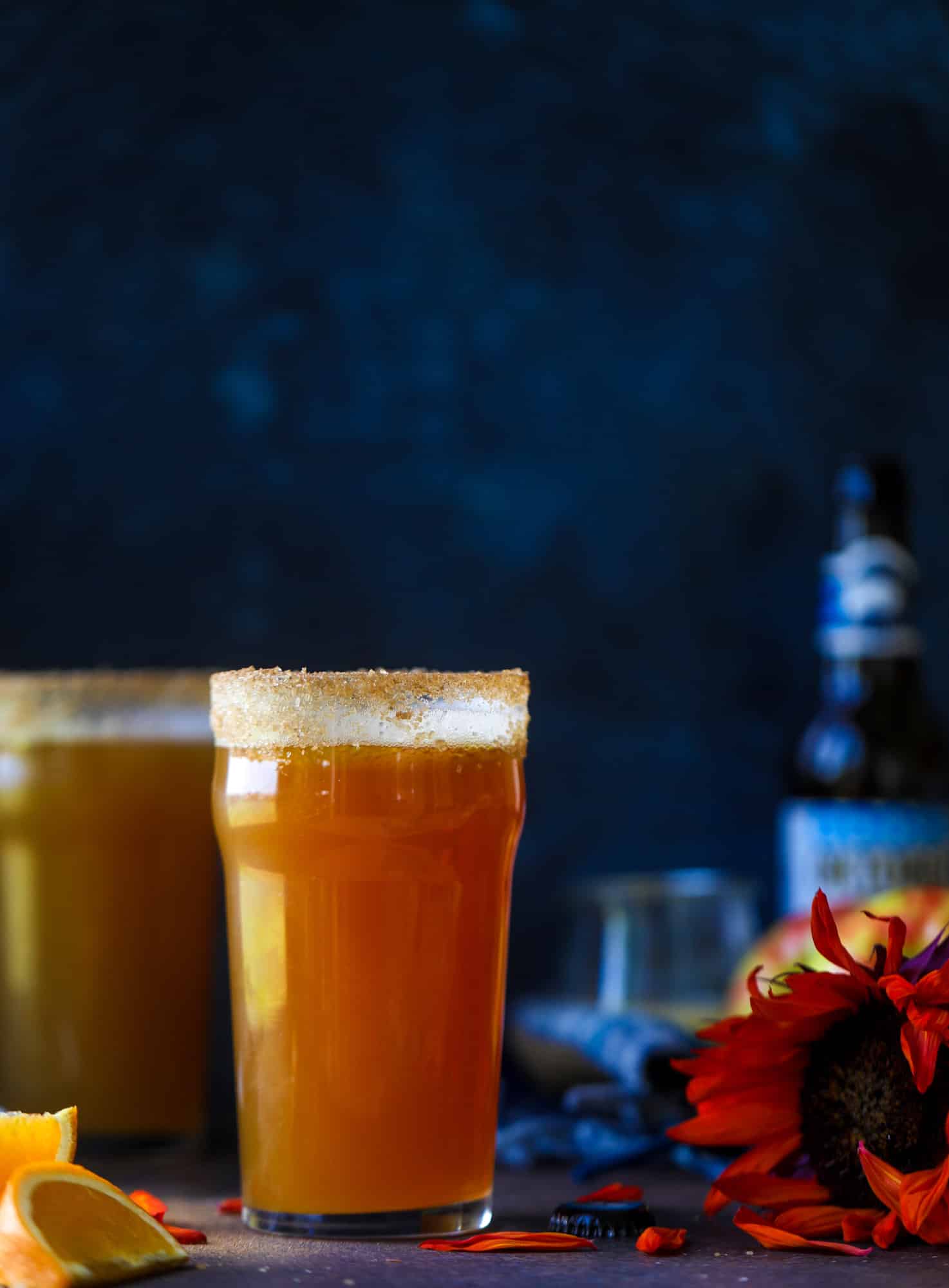 This apple cider shandy recipes is perfect for the fall season! Apple cider, sparkling cider and your favorite beer come together in an icy glass to create the best flavor ever. Finished with a cinnamon sugar rim, there's nothing better! I howsweeteats.com #apple #cider #shandy #cocktails #beer