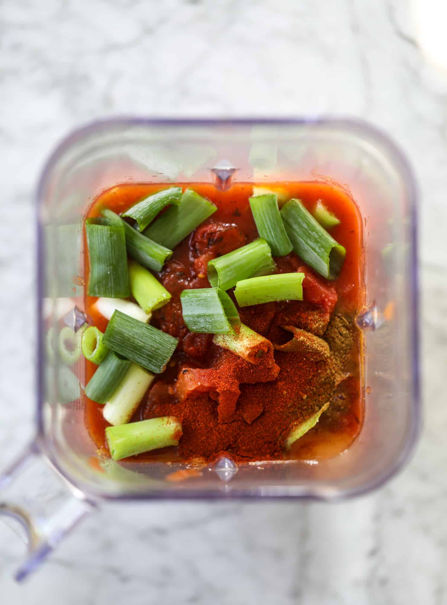 This skillet of fire roasted chicken chilaquiles is so easy, flavorful and delicious! A quick blender sauce made with fire roasted tomatoes, shredded chicken, lots of tortilla chips and your favorite toppings. Give me all the cheese and guacamole! I howsweeteats.com #chicken #chilaquiles #recipe #easy #dinner