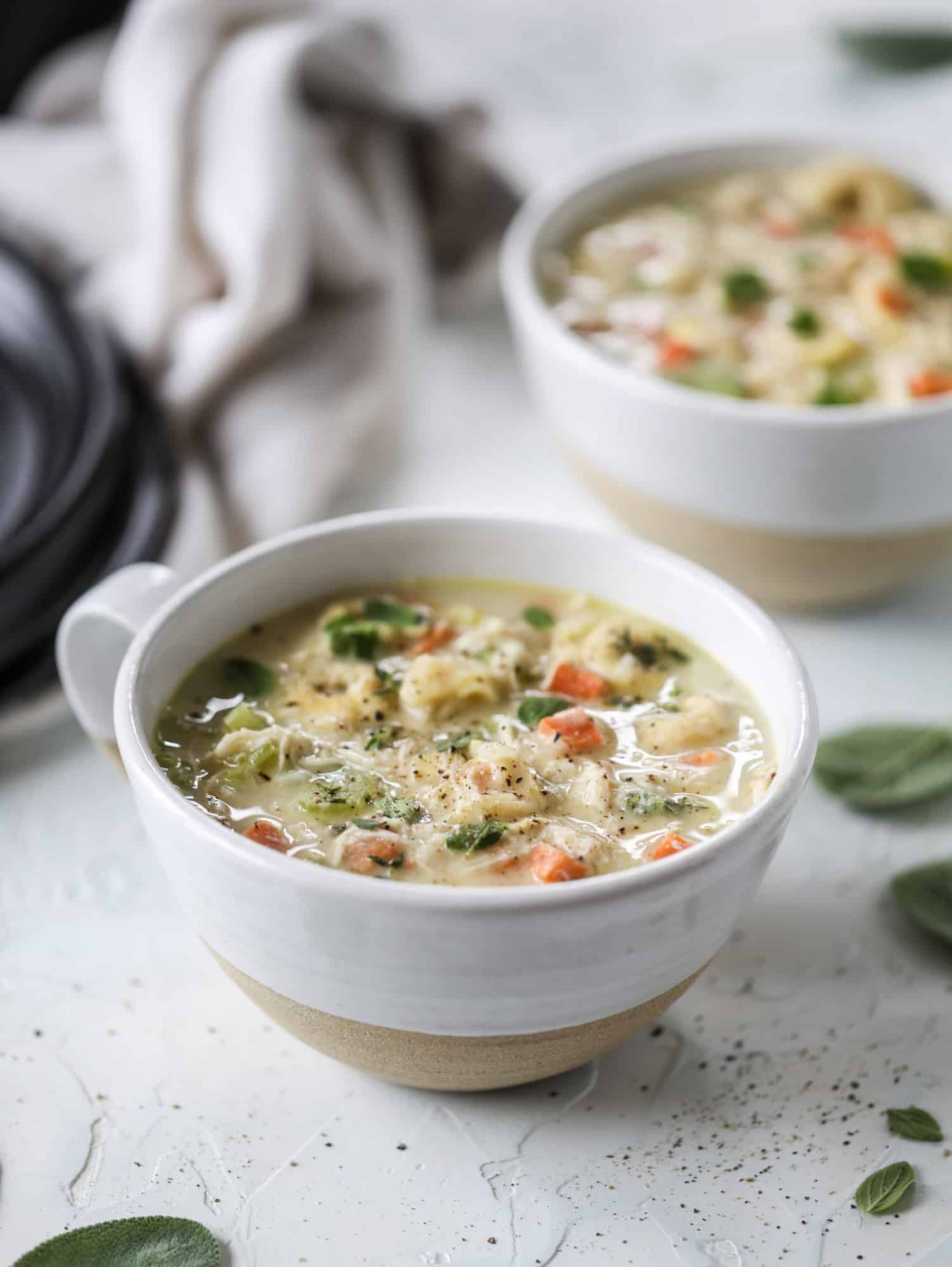 This creamy chicken tortellini soup is the perfect weeknight meal! It comes together quickly and is a great meal to use up a rotisserie chicken. It's satisfying and hearty, with tortellini replacing egg noodles for the pasta. Comfort food perfection! I howsweeteats.com #chicken #soup