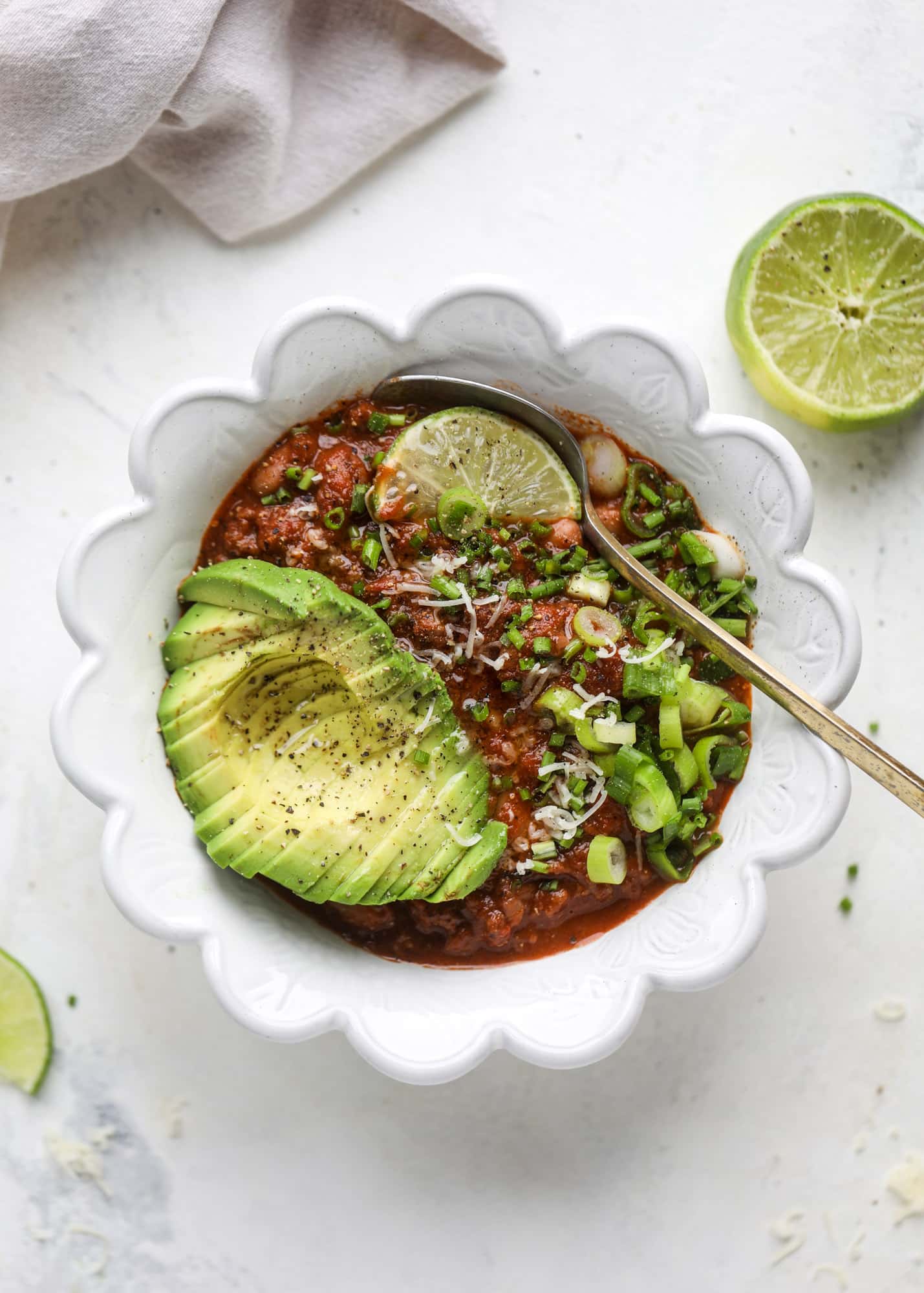 This fire and ice chili has a secret ingredient that makes it rich, velvety and insanely delicious. Dark chocolate ice cream is stirred in before serving and adds a crazy depth of flavor while bringing so much richness to your favorite bowl. You have to try it! I howsweeteats.com #chili #recipe #ice #cream #chili #bar