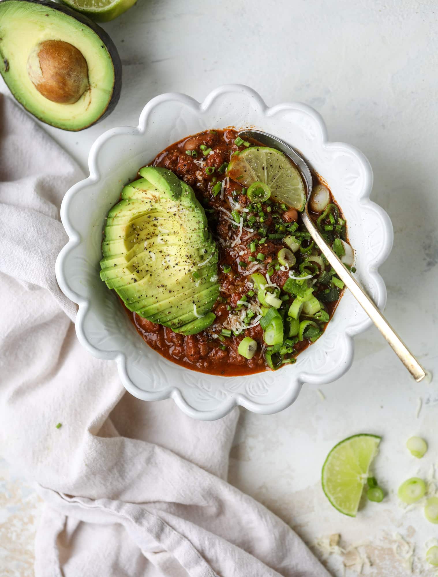 This fire and ice chili has a secret ingredient that makes it rich, velvety and insanely delicious. Dark chocolate ice cream is stirred in before serving and adds a crazy depth of flavor while bringing so much richness to your favorite bowl. You have to try it! I howsweeteats.com #chili #recipe #ice #cream #chili #bar