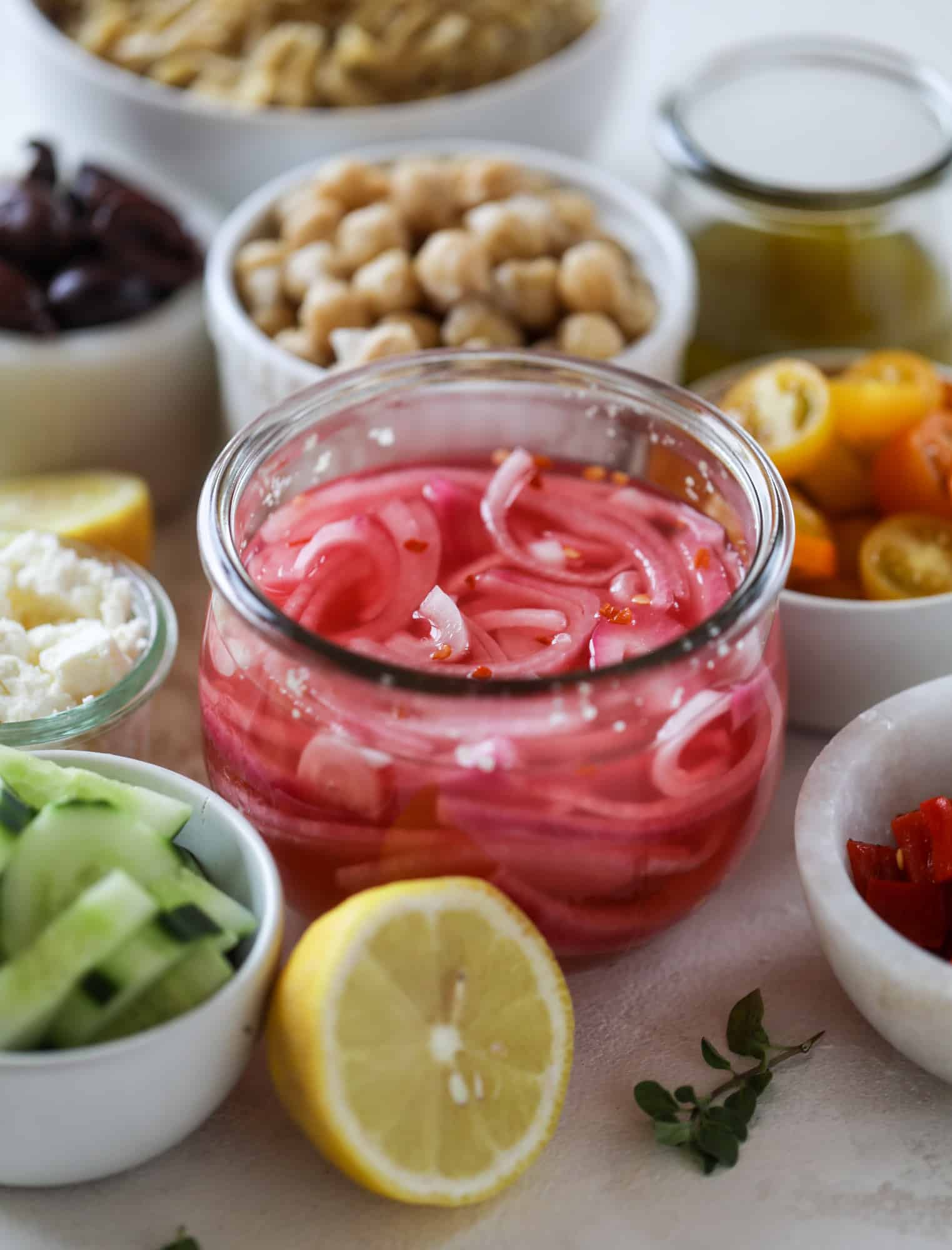This incredible greek orzo salad in a jar is to die for! The recipe is so easy and flavorful, super satisfying and perfect for meal prep. This salad in a jar is a delicious lunch idea for the weekdays and keeps you feeling full and happy! I howsweeteats.com #salad #jar #greek #orzo #recipes #healthy #lunch #mealprep