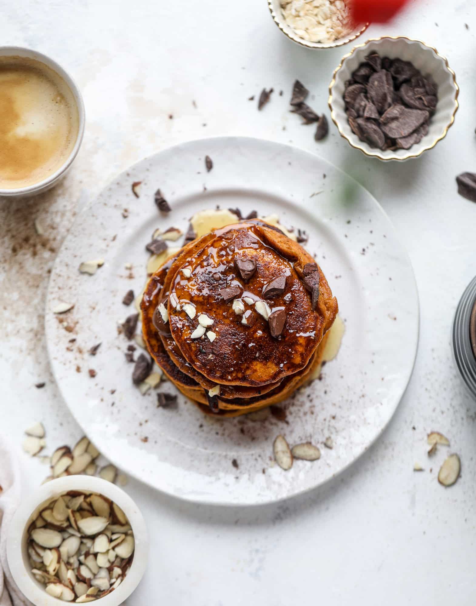 These pumpkin protein pancakes are packed with delicious ingredients to make a healthy and satisfying fall breakfast! They are super easy - you throw everything into a blender to create the most incredible protein pancakes! I howsweeteats.com #protein #pancakes #pumpkin #breakfast #fall