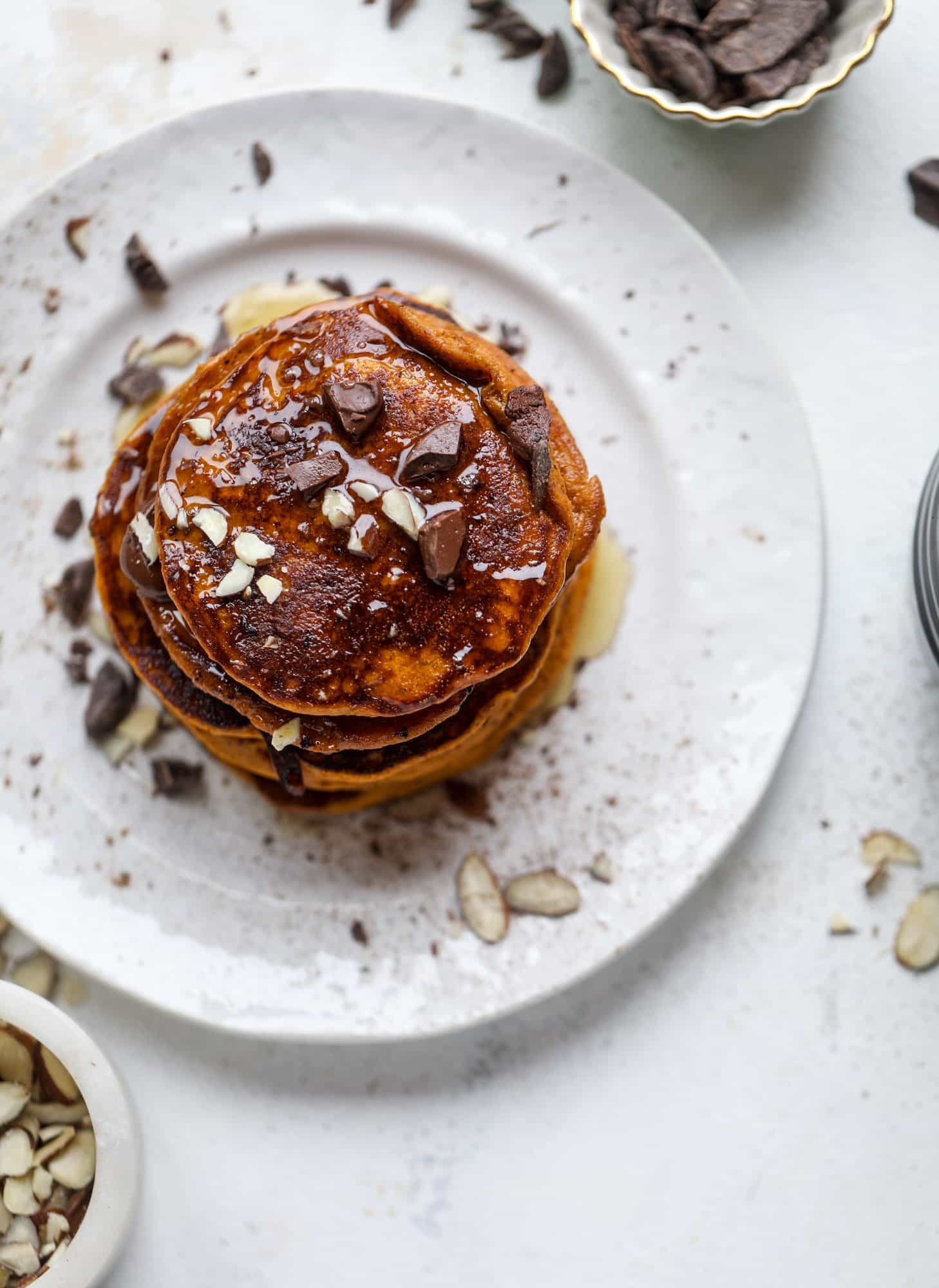 These pumpkin protein pancakes are packed with delicious ingredients to make a healthy and satisfying fall breakfast! They are super easy - you throw everything into a blender to create the most incredible protein pancakes! I howsweeteats.com #protein #pancakes #pumpkin #breakfast #fall