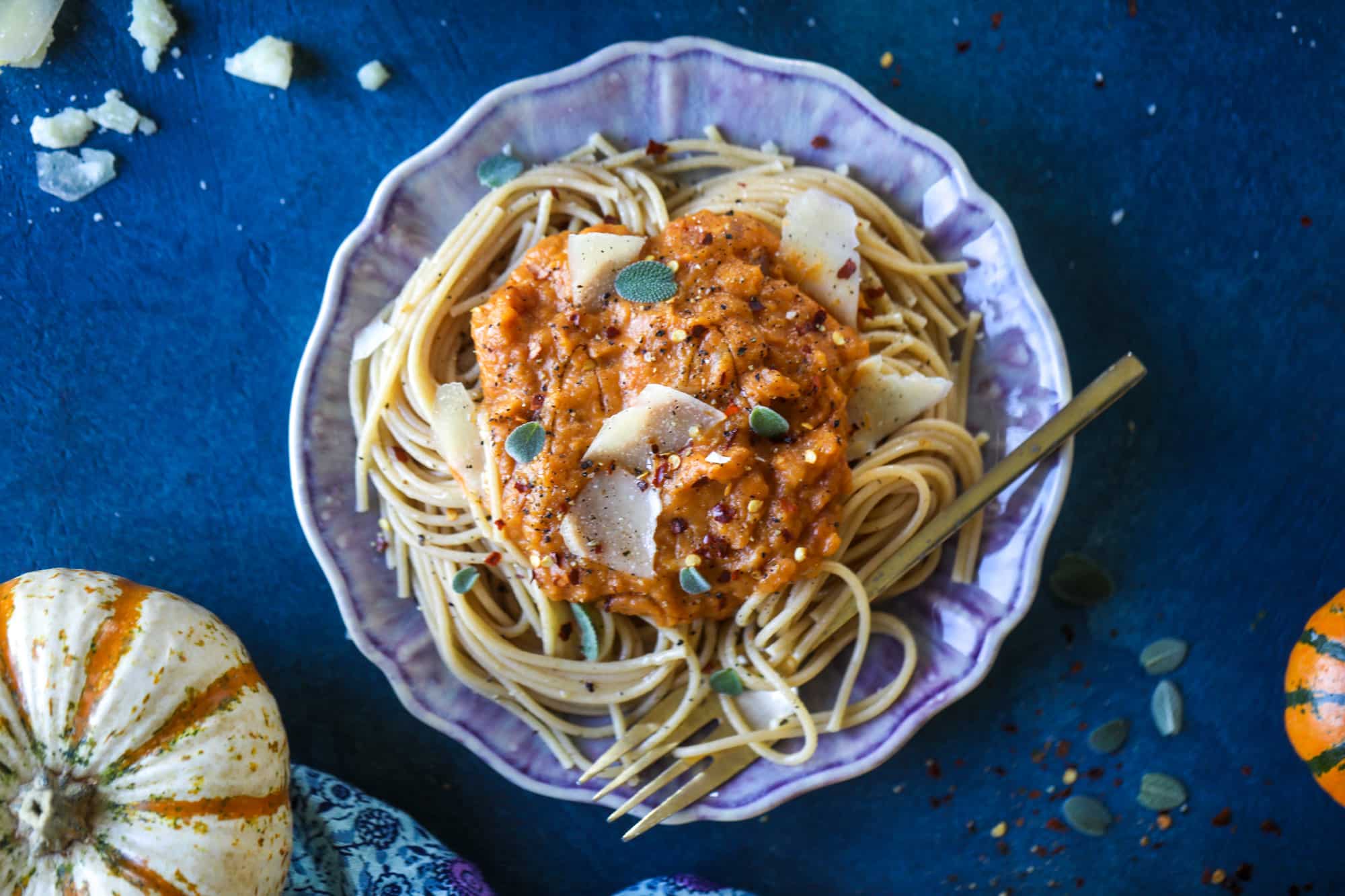 This butternut squash pasta sauce is heaven for an October dinner! Fire roasted tomatoes, butternut squash, pumpkin, sage, spice and parmesan all come together to create a delicious, simmered pot of sauce to blanket your favorite pasta! I howsweeteats.com #butternut #squash #pasta #sauce