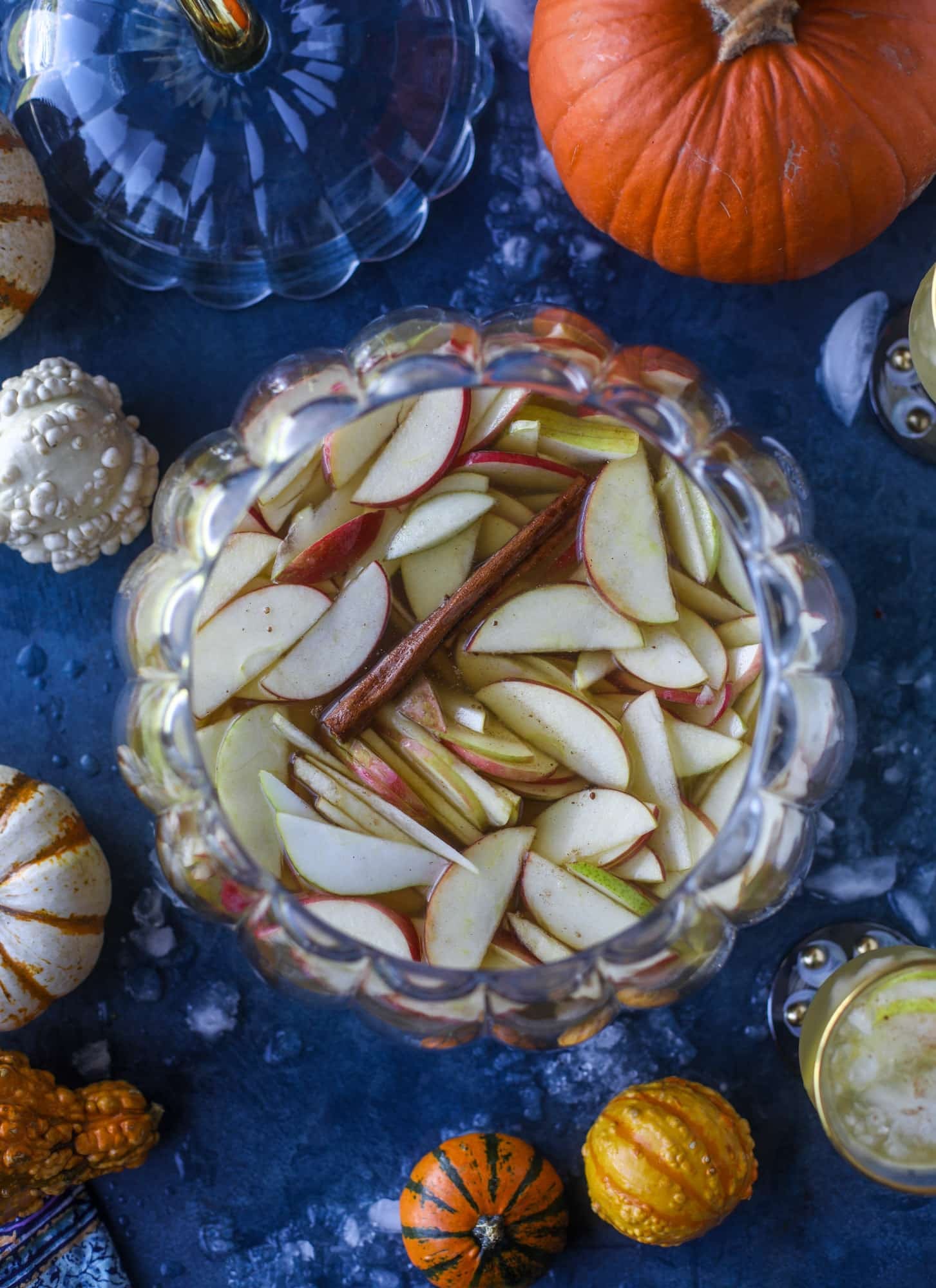 This pumpkin sangria is perfect for the fall and holiday season! A homemade pumpkin pie syrup gives the drink excellent flavor along with bubbles and apple cider and of course, boozy fruit. It's a favorite for Halloween or Thanksgiving! I howsweeteats.com #pumpkin #sangria