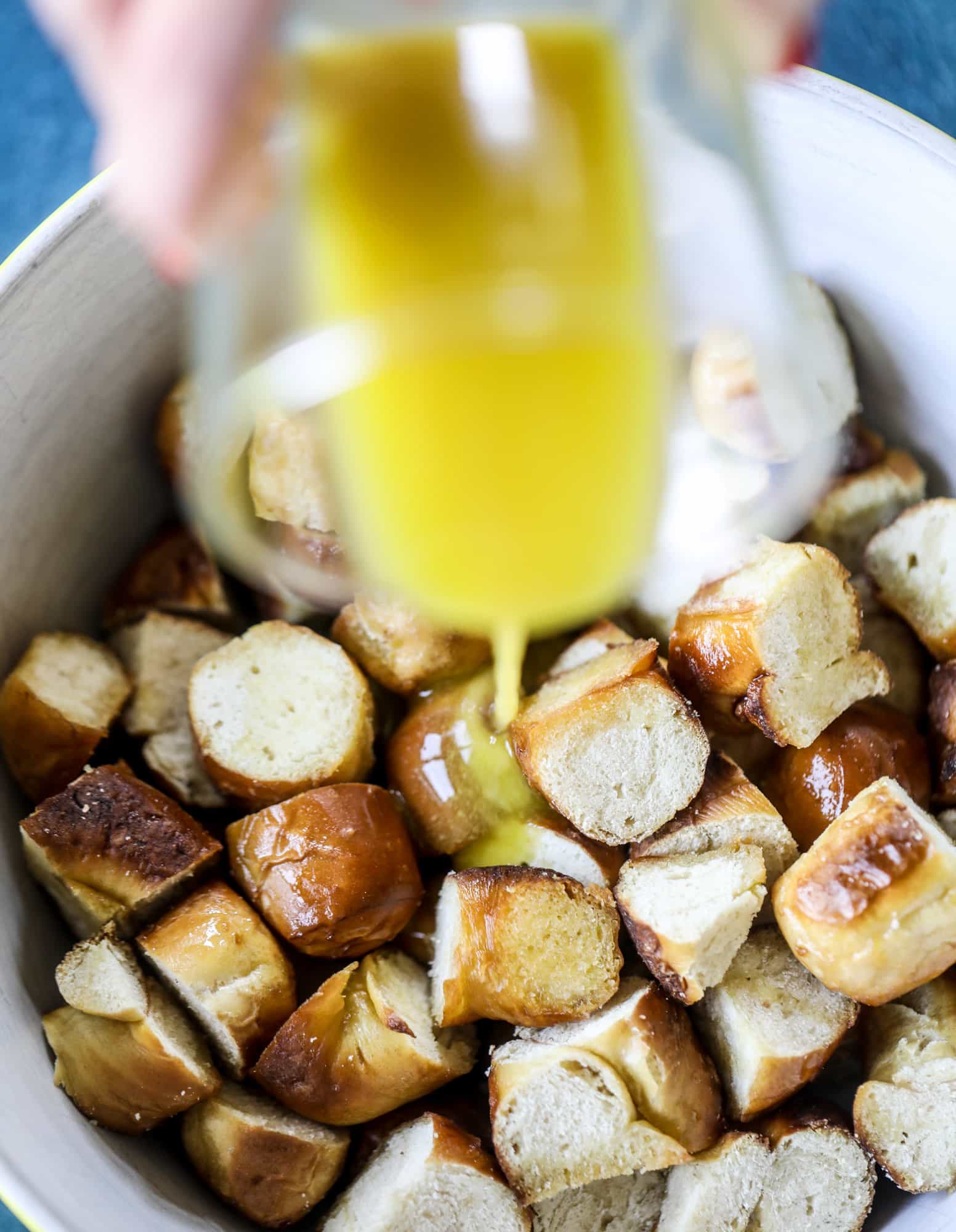This soft pretzel panzanella with mustard vinaigrette is the best flavor combination for a fall salad there is! Crispy bacon, brussels sprouts, caramelized onion and chopped apple comes together to make for a satisfying delicious autumn salad. I howsweeteats.com #soft #pretzel #panzanella #mustard #apple #brusselssprouts