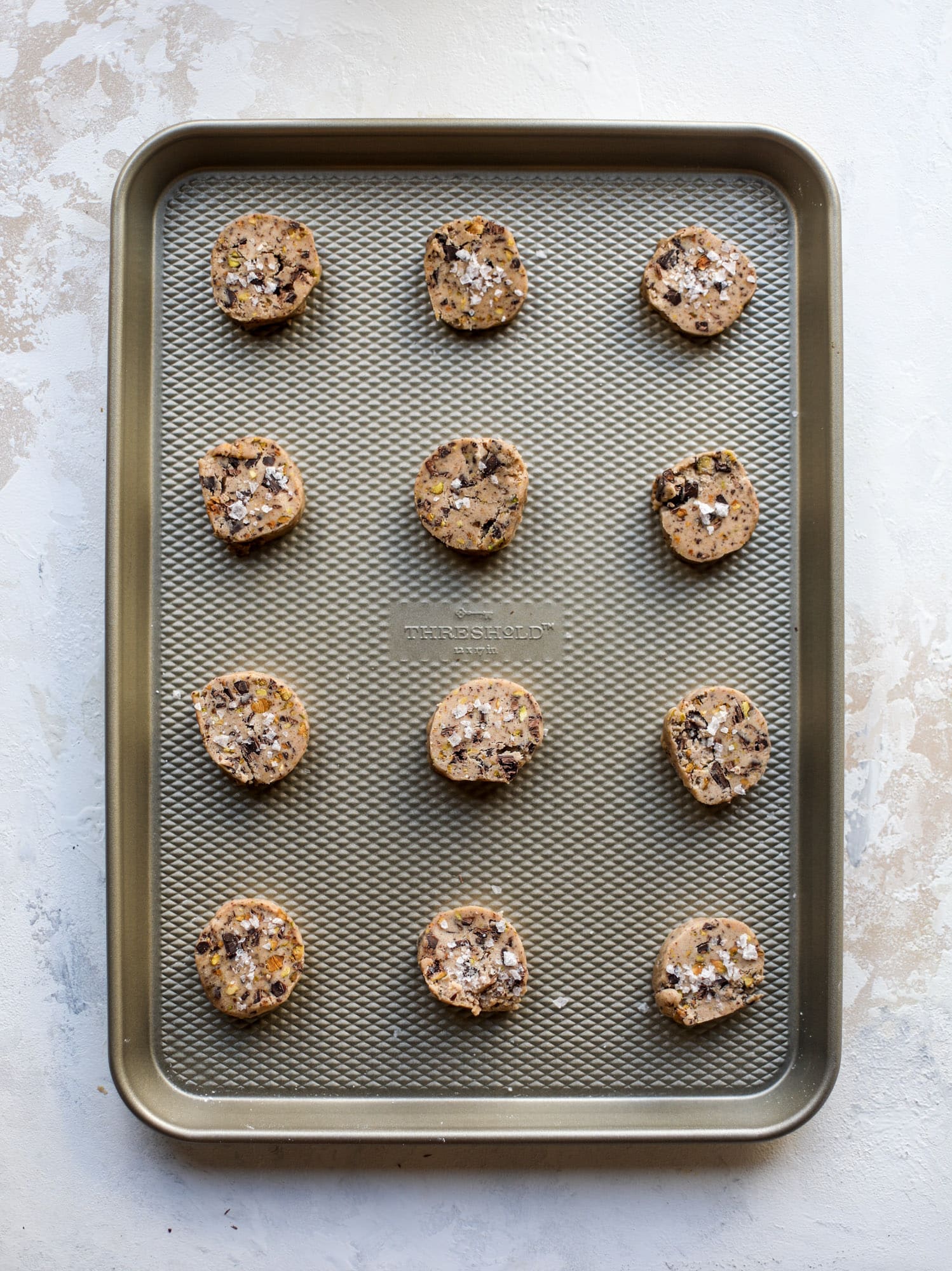 This chocolate pistachio shortbread recipe is the perfect combo of sweet and salty in a crunchy cookie! Melty, rich dark chocolate comes together with roasted, salted pistachios to make a delicious crunchy cookie! I howsweeteats.com #chocolate #pistachio #shortbread