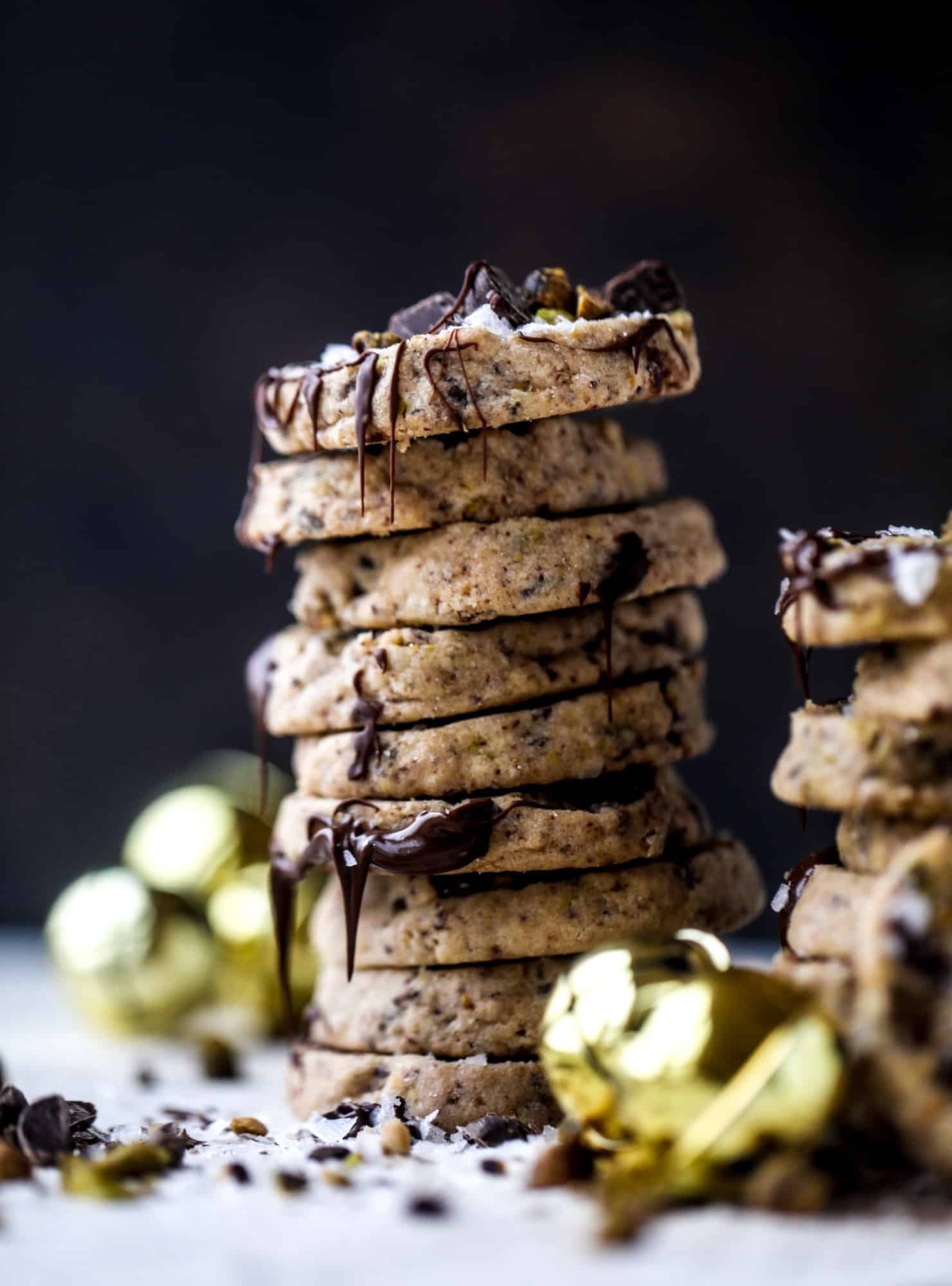 This chocolate pistachio shortbread recipe is the perfect combo of sweet and salty in a crunchy cookie! Melty, rich dark chocolate comes together with roasted, salted pistachios to make a delicious crunchy cookie! I howsweeteats.com #chocolate #pistachio #shortbread