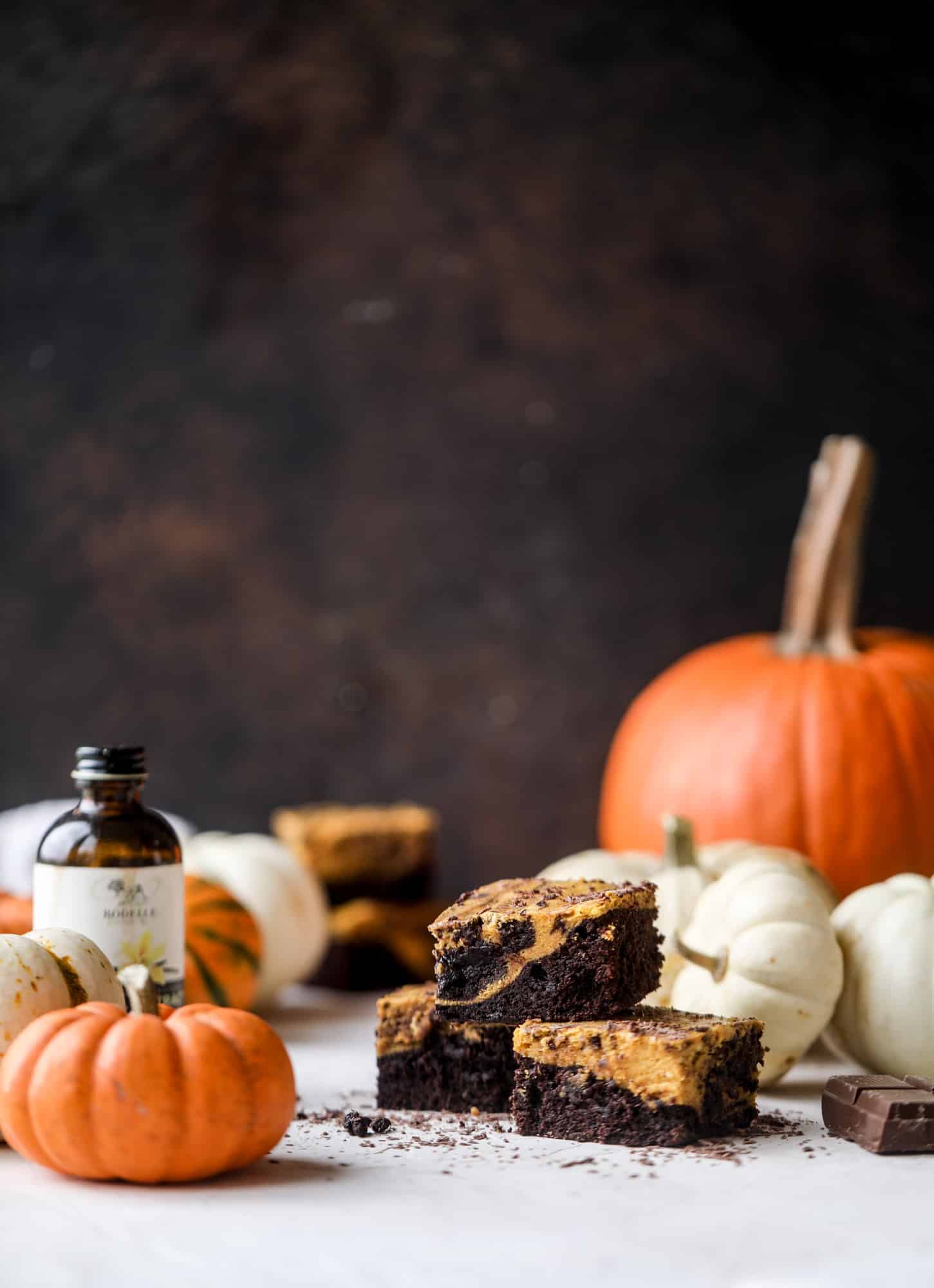 These pumpkin brownies have a fudgy layer of chocolate on the bottom and a silky layer of pumpkin on top! They are so delicious and rich and perfect for fall. The pumpkin brownies come together easily and can be made ahead of time too! I howsweeteats.com #pumpkin #brownies